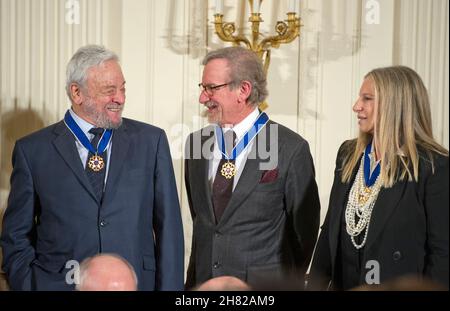 Composer and lyricist Stephen Sondheim, left, American film director, producer, philanthropist, and entrepreneur Steven Spielberg, center, and Singer, actor, director and songwriter Barbra Streisand, right, after receiving the Presidential Medal of Freedom from United States President Barack Obama during a ceremony in the East Room of the White House in Washington, DC on Tuesday, November 24, 2015. The Medal is the highest US civilian honor, presented to individuals who have made especially meritorious contributions to the security or national interests of the US, to world peace, or to cultur