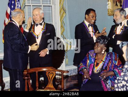 The recipients of the 16th Annual Kennedy Center Honors share an informal moment as they pose for a group photo following a dinner at the United States Department of State in Washington, DC on Saturday, December 4, 1993. From left to right: conductor Georg Solti, former 'Tonight Show' host Johnny Carson, Arthur Mitchell, founder of the Dance Theatre of Harlem, gospel singer Marion Williams and and composer and lyricist Stephen Sondheim. The 1993 honorees are: Johnny Carson, Arthur Mitchell, Georg Solti Stephen Sondheim and Marion Williams. Credit: Greg E. Mathieson/Pool via CNP