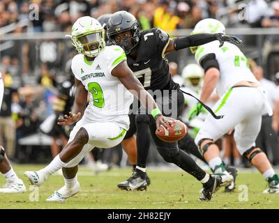 Orlando, FL, USA. 26th Nov, 2021. South Florida quarterback Timmy McClain (9) gets pressured by Central Florida defensive back Davonte Brown (7) during 1st half NCAA football game between the USF Bulls and the UCF Knights at the Bounce House in Orlando, Fl. Romeo T Guzman/Cal Sport Media/Alamy Live News Stock Photo