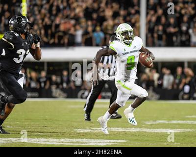 Orlando, FL, USA. 26th Nov, 2021. South Florida quarterback Timmy McClain (9) scrambles with the ball during 2nd half NCAA football game between the USF Bulls and the UCF Knights. UCF defeated USF 17-13 at the Bounce House in Orlando, Fl. Romeo T Guzman/Cal Sport Media/Alamy Live News Stock Photo