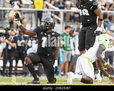 Orlando, FL, USA. 26th Nov, 2021. Central Florida defensive lineman Big Kat Bryant (1) reacts after getting the sack on South Florida quarterback Timmy McClain (9) during 1st half NCAA football game between the USF Bulls and the UCF Knights at the Bounce House in Orlando, Fl. Romeo T Guzman/Cal Sport Media/Alamy Live News Stock Photo