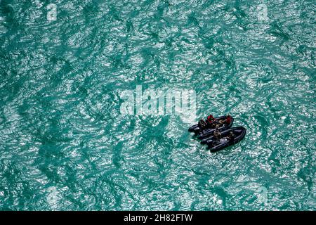 Key West, Florida, USA. 16th Nov, 2021. U.S. Air Force pararescuemen assigned to the 38th Rescue Squadron wait for air evacuation aboard combat rubber raiding craft in the Gulf of Mexico during Mosaic Tiger 22-1, Nov. 16, 2021. The pararescuemen practiced their combat search and rescue techniques in the water with the help of the 41st Rescue Squadron aircrew. Mosaic Tiger 22-1 is a command and control exercise designed to test and hone the lead-wing concept, generating airpower to austere and dispersed locations while combating degraded communications. (Credit Image: © U.S. Air Force/ZUM Stock Photo