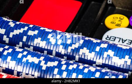 Closeup of stacked poker chips in a case on the table Stock Photo