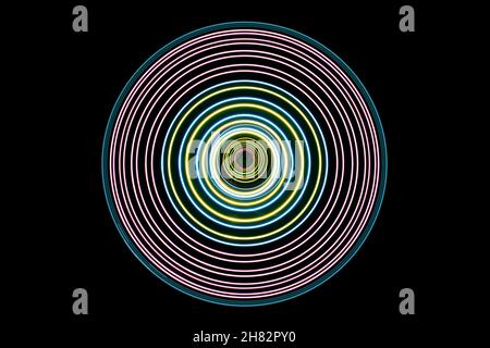 Top down view of lights painted on a turntable forming a circular pattern Stock Photo
