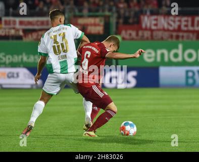 Deutschland, Fuerth, Sportpark Ronhof Thomas Sommer - 24.09.2021 - Fussball, 1.Bundesliga - SpVgg Greuther Fuerth vs. FC Bayern Munich  Image: (fLTR) Paul Seguin (SpVgg Greuther Fürth,33), Joshua Kimmich (FC Bayern Munich,6)  DFL regulations prohibit any use of photographs as image sequences and or quasi-video Stock Photo