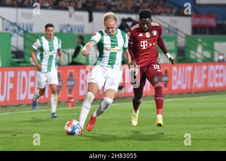 Deutschland, Fuerth, Sportpark Ronhof Thomas Sommer - 24.09.2021 - Fussball, 1.Bundesliga - SpVgg Greuther Fuerth vs. FC Bayern Munich  Image: (fLTR) Havard Nielsen (SpVgg Greuther Fürth,16), Alphonso Davies (FC Bayern Munich,19)  DFL regulations prohibit any use of photographs as image sequences and or quasi-video Stock Photo