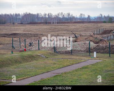 Rows of barbed wire on the state border. The separation of the two countries. Foggy autumn landscape  Stock Photo