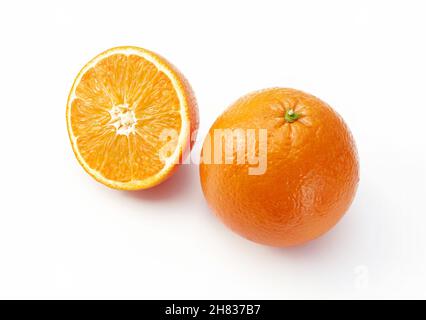 Oranges on white background. One whole and a half. Stock Photo