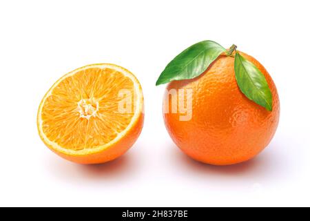 Oranges on white background. One whole with leaves and a half. Stock Photo