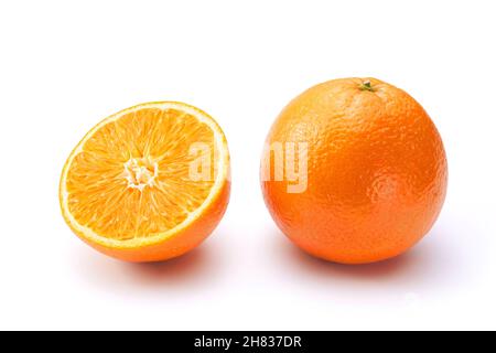 Oranges on white background. One whole and a half. Stock Photo