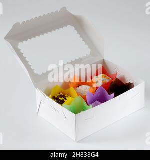 Box with tulip forms, confectionery object isolated over white background Stock Photo