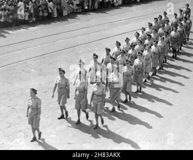 Inscription on the back of the photo, written by Northern Irish WAAF Cora Anderson: 'V Day Parade, Bombay, Monday 14th August 1945. Dearest Mammy, don't you think this looks good? Smart WAAFs eh? I don't look TOO fat - do I???? This is the only copy I've got, so don't lose it.'  Women's Auxiliary Air Force personnel (WAAFs) arrived in India in November 1944. All WAAF personnel were withdrawn from India by June 1946 due to the political situation. Stock Photo