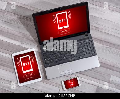 Emergency concept shown on different information technology devices Stock Photo