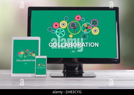 Collaboration concept shown on different information technology devices Stock Photo