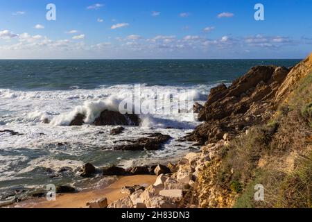 Waves Crashing Over a Rock Stock Photo