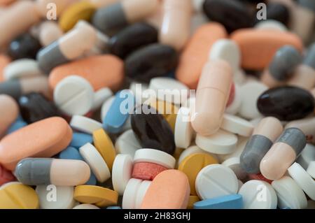 Close up photo of different kinds of pills and medicine. Concept of waste or recycle medicine. Stock Photo