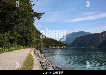 Achen Lake and Natural Pathway in Tyrol. Beautiful Scenery of Austrian Achensee during Day. Stock Photo