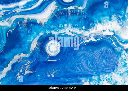 Epoxy resin art. Resin art with blue and white colors. Abstract composition for your design. Stock Photo