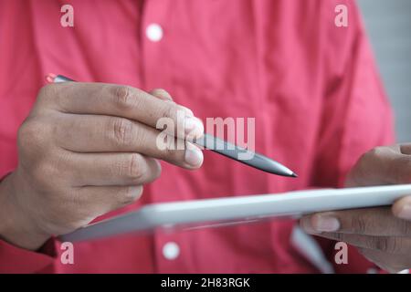 using digital tablet and graphic on table  Stock Photo