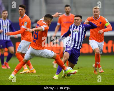Aue, Germany. 27th Nov, 2021. Football: 2. Bundesliga, FC Erzgebirge Aue - SV Darmstadt 98, Matchday 15, Erzgebirgsstadion. Aue's John-Patrick Strauß (M) against Darmstadt's Emir Karic, behind him Fabian Holland (r). Credit: Robert Michael/dpa-Zentralbild/dpa - IMPORTANT NOTE: In accordance with the regulations of the DFL Deutsche Fußball Liga and/or the DFB Deutscher Fußball-Bund, it is prohibited to use or have used photographs taken in the stadium and/or of the match in the form of sequence pictures and/or video-like photo series./dpa/Alamy Live News Credit: dpa picture alliance/Alamy Live 