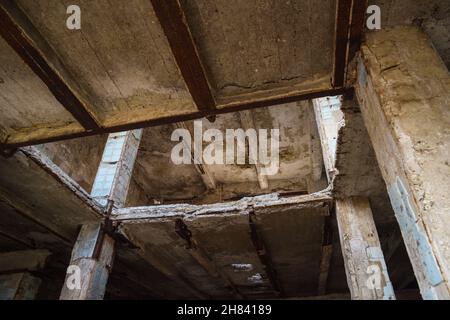 Abandoned concrete construction with destructed ceiling horizontal Stock Photo