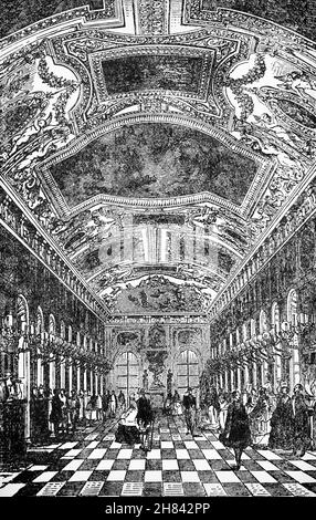 A late 19th Century illustration of the Galerie d'Apollon (Apollo Gallery) in the wing known as the Petite Galerie, in the Louvre Palace, Paris, France. After a fire destroyed an earlier gallery in 1661, Louis XIV ordered this part of the Louvre to be rebuilt.  Architectural work was entrusted to Louis Le Vau, while Charles Le Brun was assigned responsibility for decorations by Jean-Baptiste Colbert. Le Brun's main theme for the room revolved around the movement of the sun through time and space, with the figure of Apollo glorifying Louis as the sun king. Stock Photo