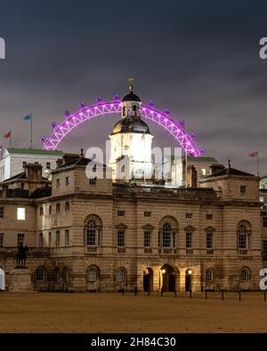 A long exposure night capture of horse guards parade in London with he lastminute.com London eye in the background Stock Photo