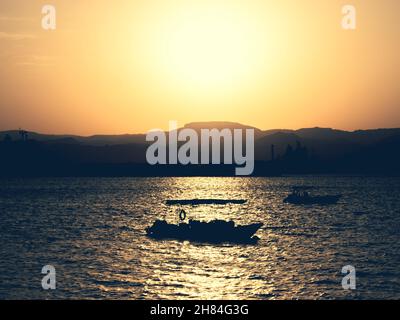 Scenic view at sunset from Aqaba Port , Jordan. Sunset on the Red Sea Stock Photo