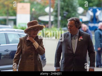 Ascot, Berkshire, UK. 20th November, 2021. Camilla, Duchess of Cornwall was met by Sir Francis Brooke, Her Majesty’s Representative and Chairman, Ascot Racecourse as she arrived at Ascot Races today for the November Racing Weekend. Credit: Maureen McLean/Alamy Stock Photo