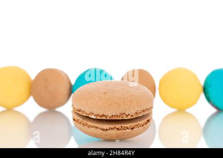 Several sweet macaroons, close-up, isolated on white. Stock Photo