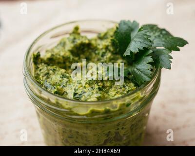 Home made vegan celery leaf pesto in a jar.