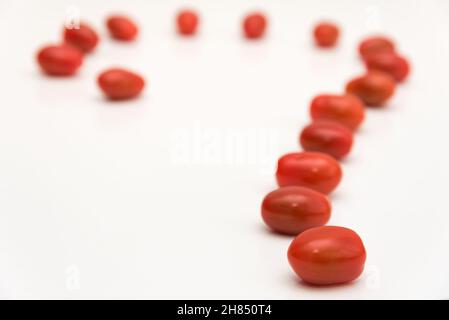 Fresh cherry tomato in row on white background Stock Photo
