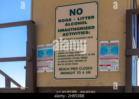 San Clemente, CA, USA – November 13, 2021: Rules and restrictions posted on the backside of a lifeguard tower in San Clemente Beach. Stock Photo