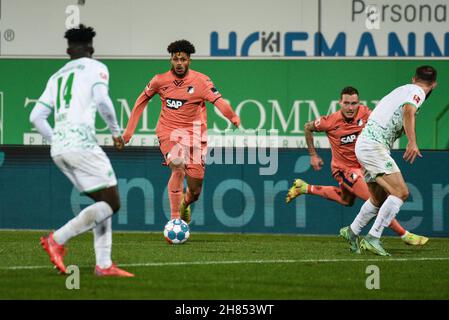 Deutschland, Fuerth, Sportpark Ronhof Thomas Sommer - 27.11.2021 - Fussball, 1.Bundesliga - SpVgg Greuther Fuerth vs. TSG 1899 Hoffenheim  Image: (fLTR) Georginio Rutter (TSG 1899 Hoffenheim, 33) shooting in his 2nd goal of the match to put the score 2:4 in the 57th minute; Hans Nunoo Sarpei SpVgg Greuther Fürth,14) defending..  DFL regulations prohibit any use of photographs as image sequences and or quasi-video Stock Photo