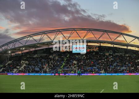 The sun sets over the John Smiths Stadium at half time Stock Photo