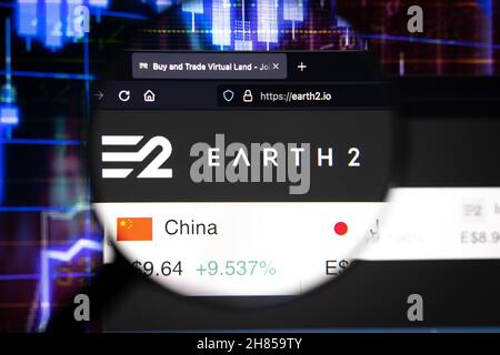 Earth 2 company logo on a website, seen on a computer screen through a magnifying glass. Stock Photo