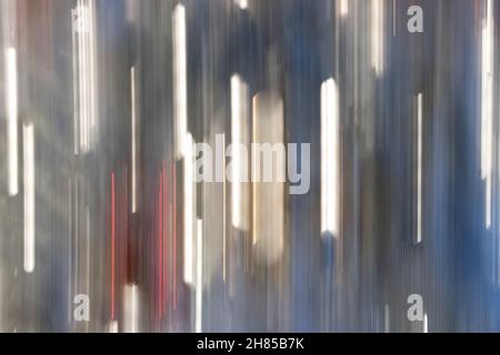 abstract background image with moving vertical stripes of glowing light in red, white and blue good for sparkly, technology, electric concepts Stock Photo
