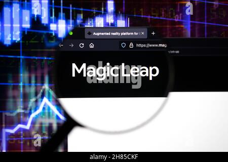 Magic leap company logo on a website, seen on a computer screen through a magnifying glass. Stock Photo