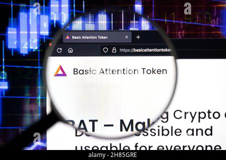 Basic Attention Token company logo on a website, seen on a computer screen through a magnifying glass. Stock Photo