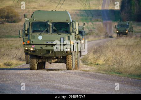 Convoy of British army MAN SV 8x8 EPLS logistics trucks driving an ...