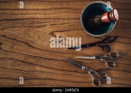 Tools of barber shop on wooden background. Top view. Copy space. Stock Photo