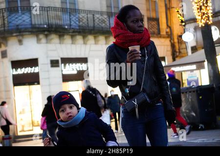 MONTPELLIER, FRANCE - Jan 06, 2021: A low angle closeup of a Mother and Son out on a cold winter evening in Montpellier Stock Photo