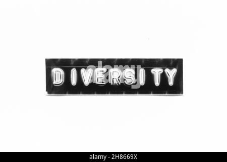 Embossed letter with word diversity in black banner on white paper background Stock Photo