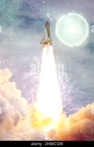 Rocket starts into space. Concept . Spaceship lift off with blast and smoke on the background. Elements of this image furnished by NASA Stock Photo