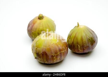 Three Fresh ripe figs on white background Stock Photo