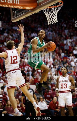 BLOOMINGTON, UNITED STATES - 2021/11/27: Marshall Thundering Herd guard Taevion Kinsey (24) goes to the hoop against Indiana Hoosiers forward Miller Kopp (12) during an NCAA basketball game on November 27, 2021 in Bloomington, Ind. IU beat Marshall 90-79. Stock Photo