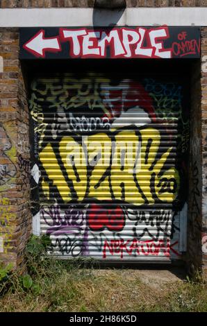 graffiti on a roller shutter door in Camden Lock, london Stock Photo