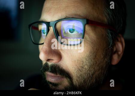 Crypto trader investor analyst looking at computer screen analyzing financial graph data on pc monitor, thinking of online stock exchange market  Stock Photo