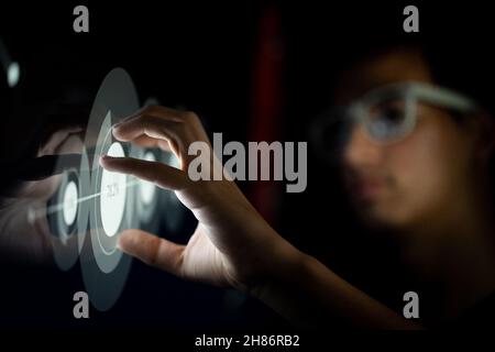 Close up of businessman hand using creative business chart hologram on blurry city background. Innovation, finance, trade, future. Stock Photo