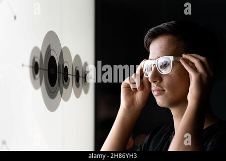 Close up of businessman hand using creative business chart hologram on blurry city background. Innovation, finance, trade, future. Stock Photo